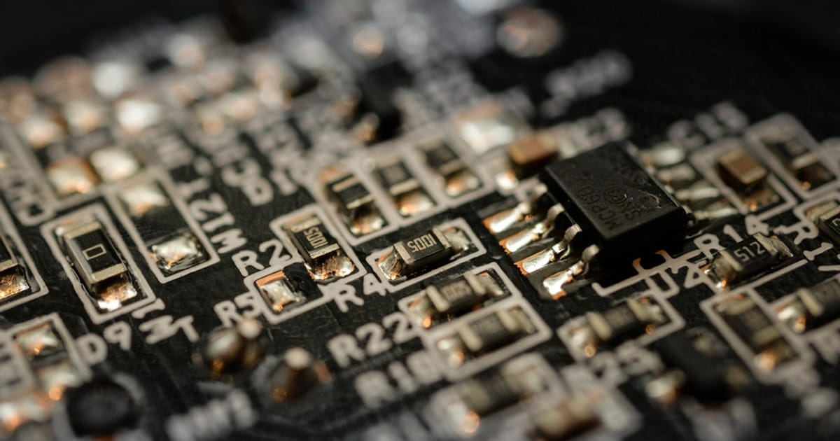 Circuit board macro — illustrating an article on AI Model Watermarking Tools A Practical Overview for 2026